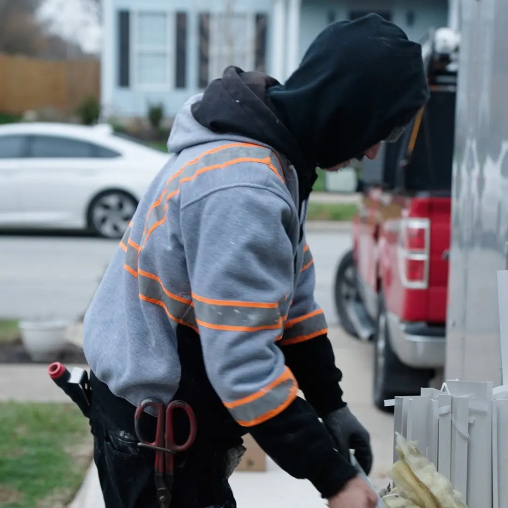 Front page Window Installer doing trimming